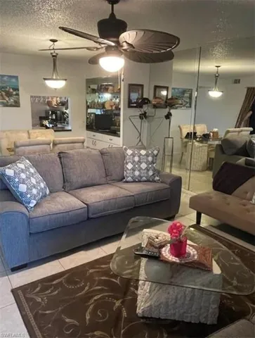 a living room with furniture and a rug