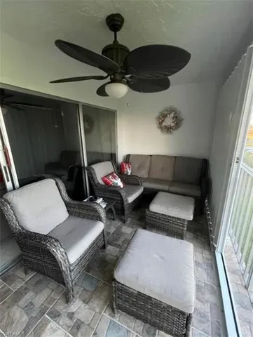 a living room with furniture and a rug