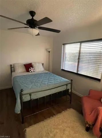 a bedroom with a bed and a furniture