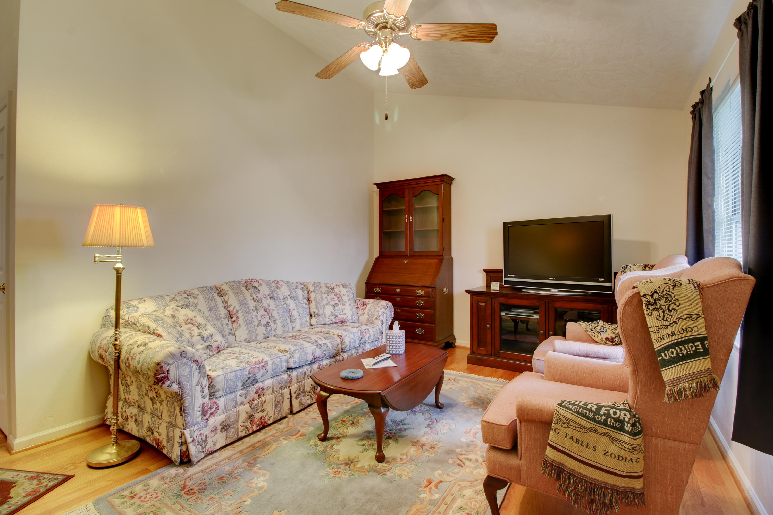 825 Ruddell Road Vinton, VA 24179 - Photo 3 of 25 a living room with furniture and a flat screen tv