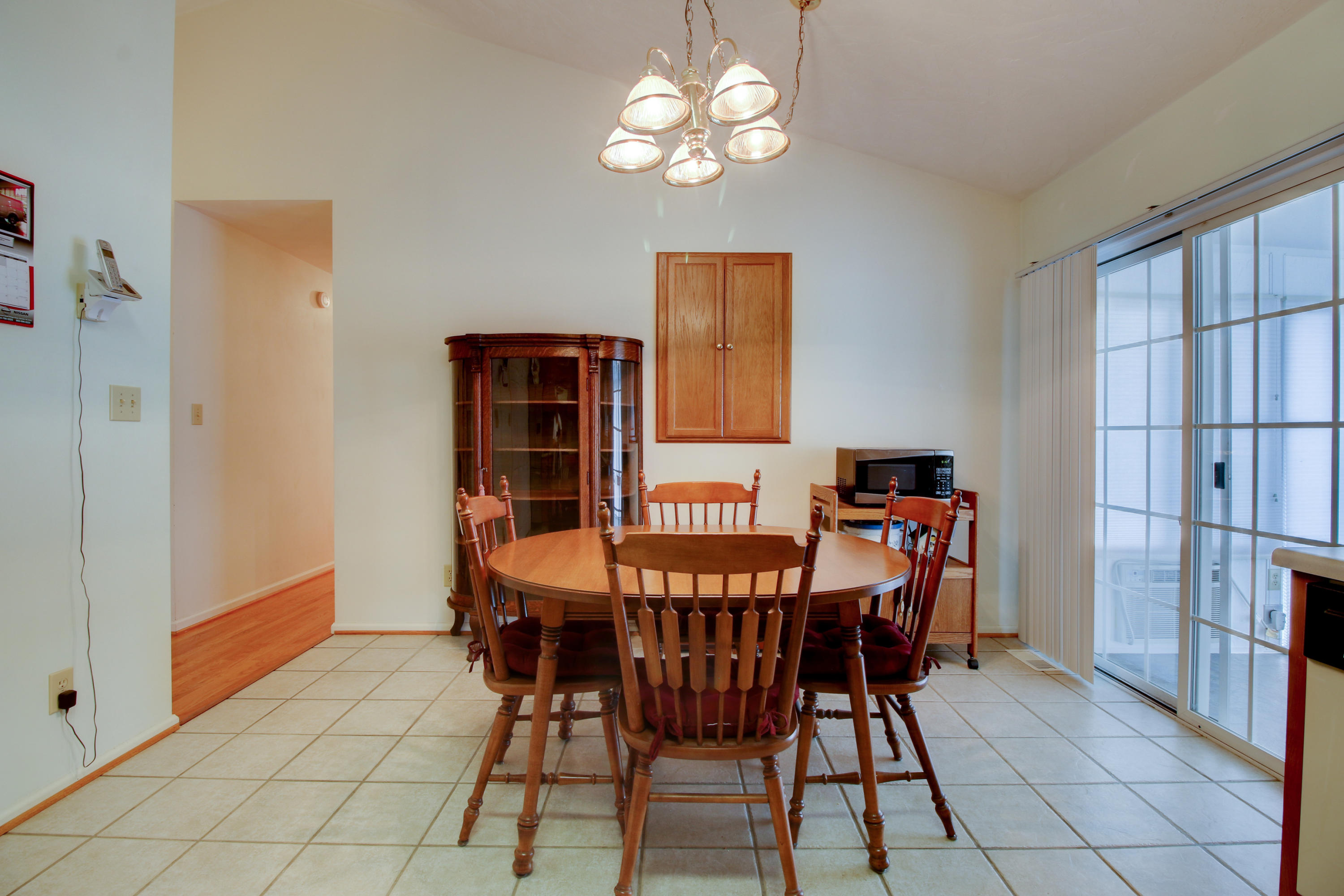 825 Ruddell Road Vinton, VA 24179 - Photo 8 of 25 a view of a dining room with furniture and chandelier