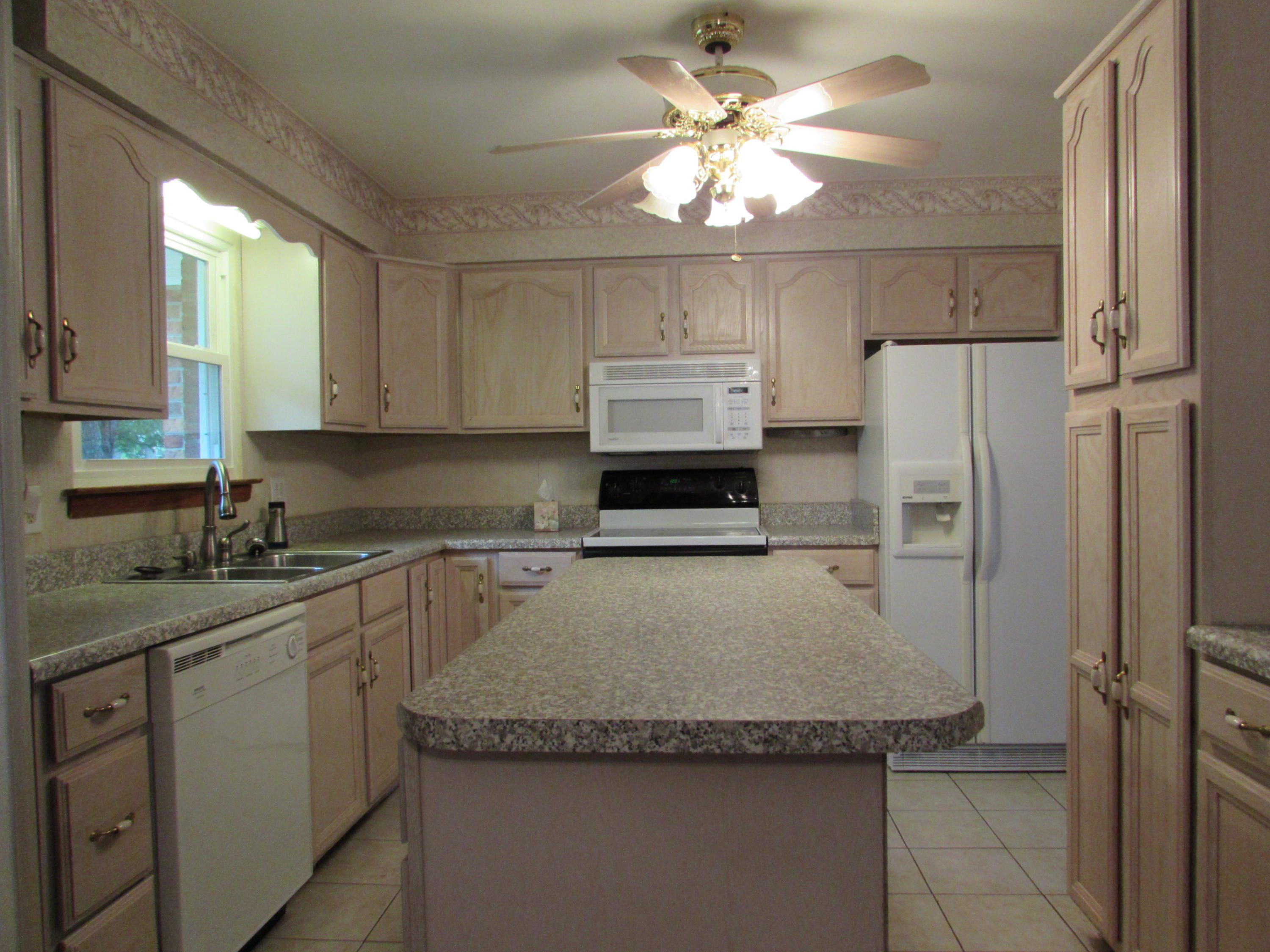 529 Olney Road Vinton, VA 24179 - Photo 13 of 13 a kitchen with stainless steel appliances granite countertop a sink stove and refrigerator