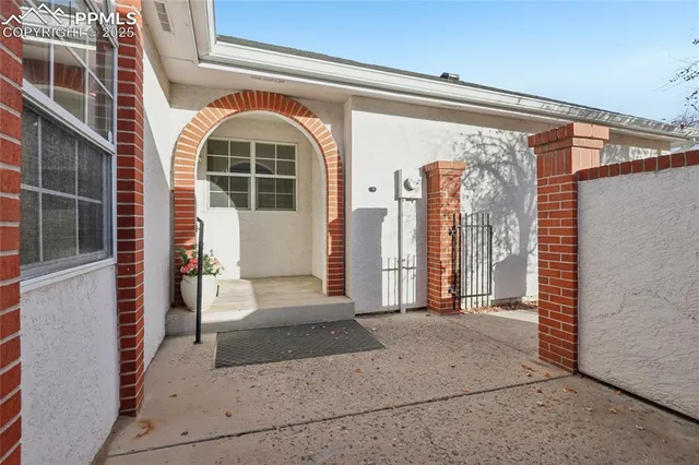 a front view of a house with large windows