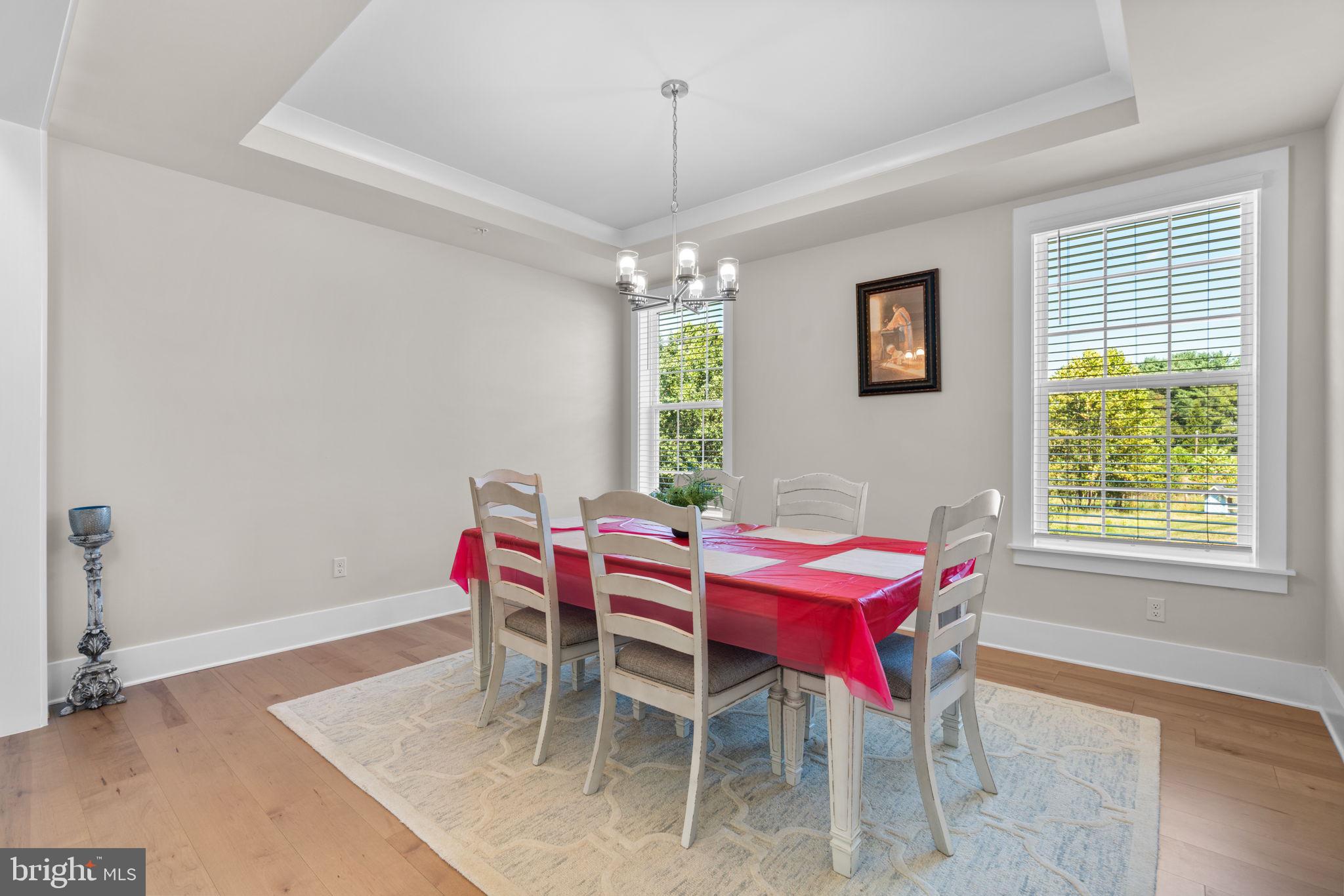 21708 Woodfield Road Gaithersburg, MD 20882 - Photo 16 of 76 a dining room with furniture and window