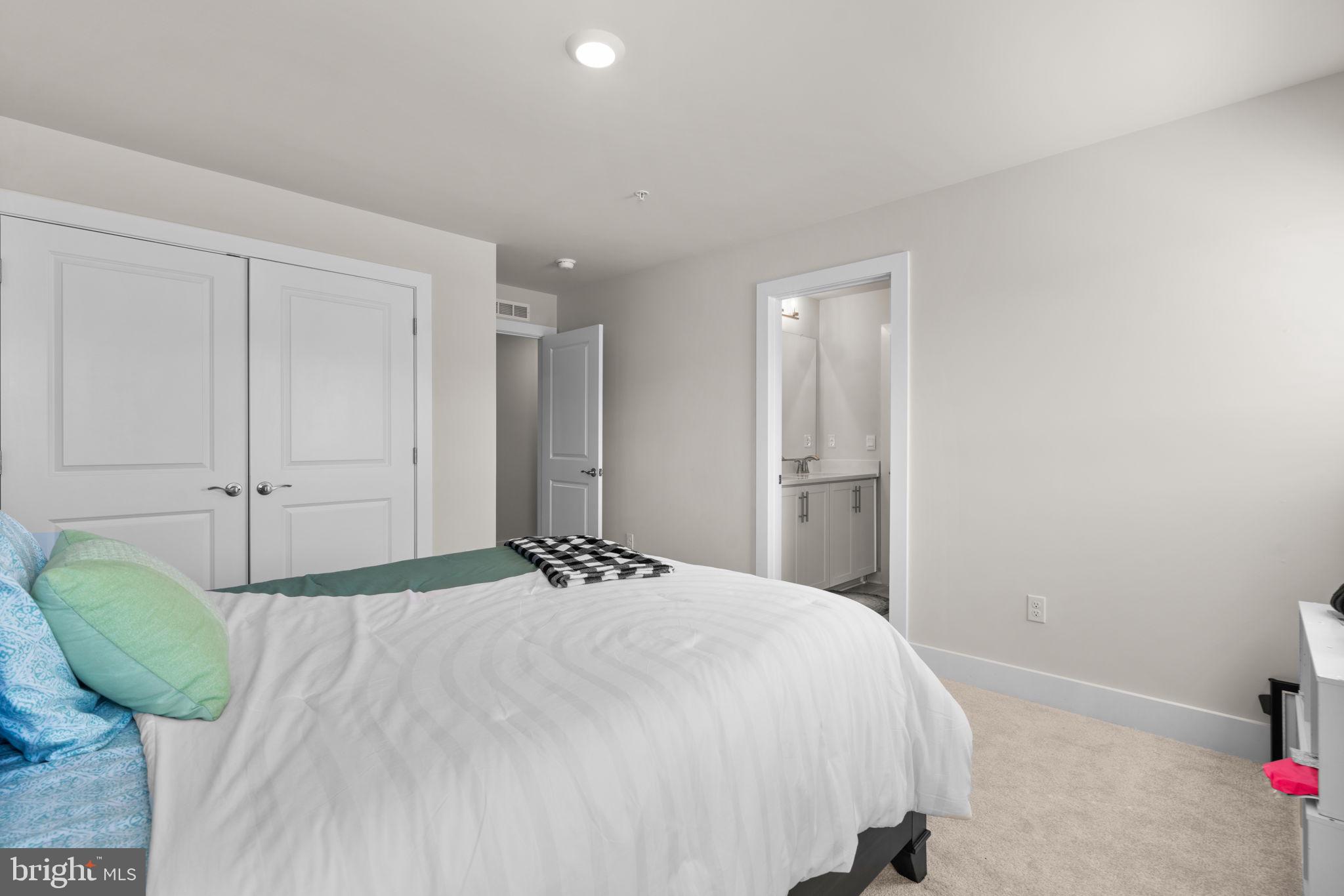 21708 Woodfield Road Gaithersburg, MD 20882 - Photo 46 of 76 a bedroom with a bed and a window