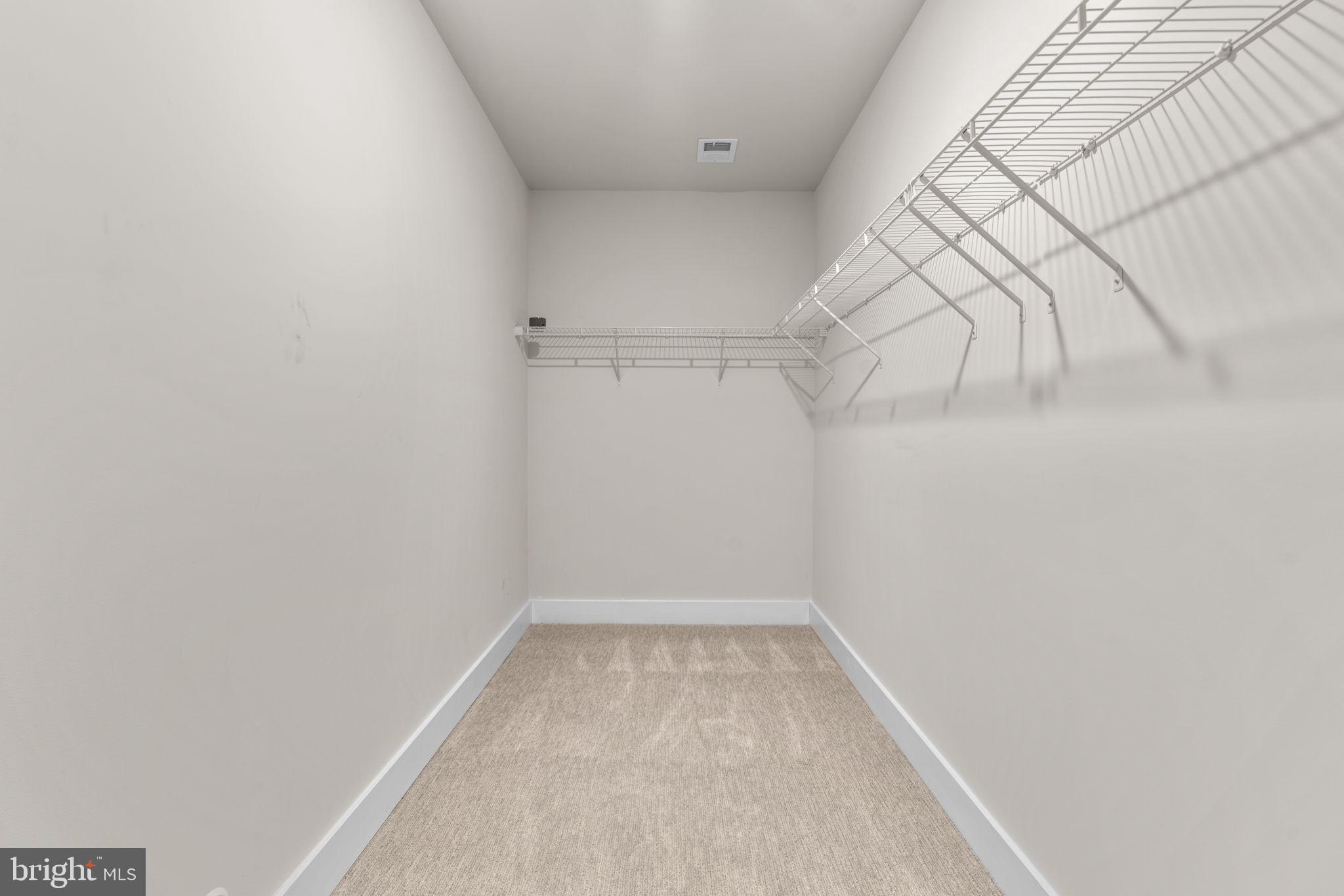 21708 Woodfield Road Gaithersburg, MD 20882 - Photo 49 of 76 a view of a room with racks on the wall