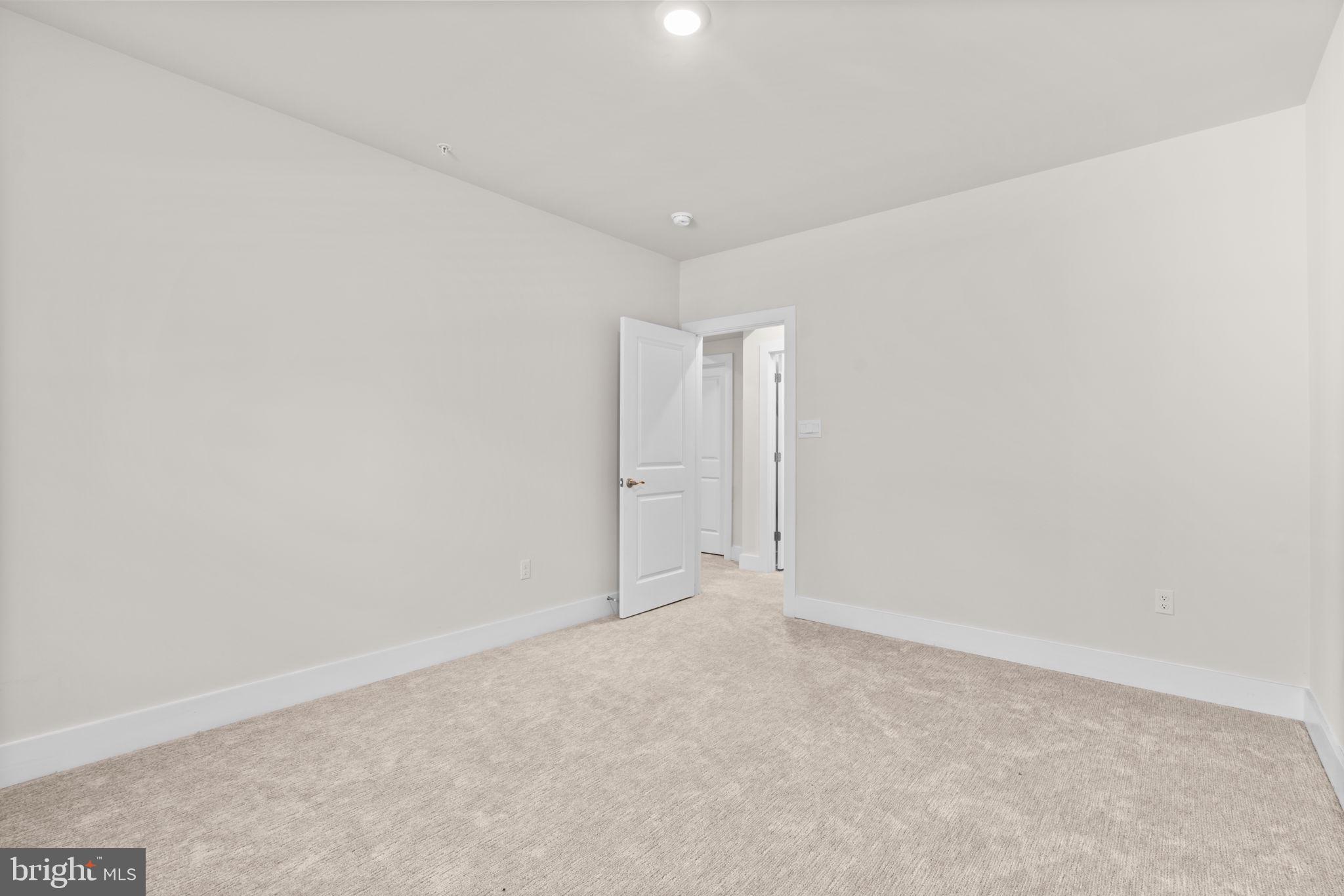 21708 Woodfield Road Gaithersburg, MD 20882 - Photo 51 of 76 a view of an empty room