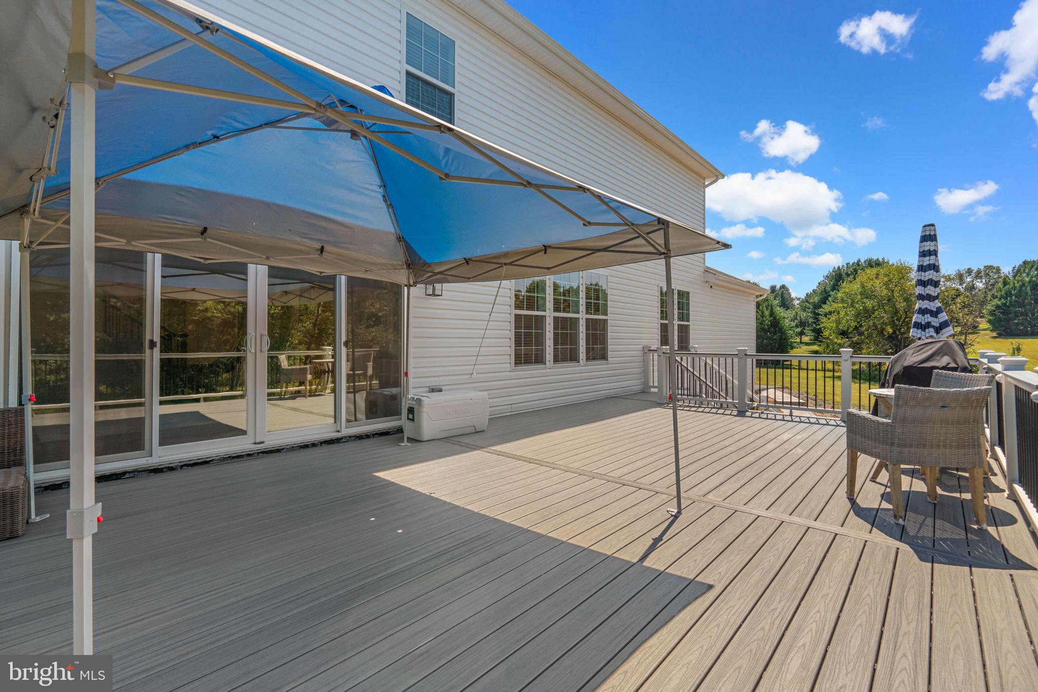 21708 Woodfield Road Gaithersburg, MD 20882 - Photo 58 of 76 a view of a house with a patio