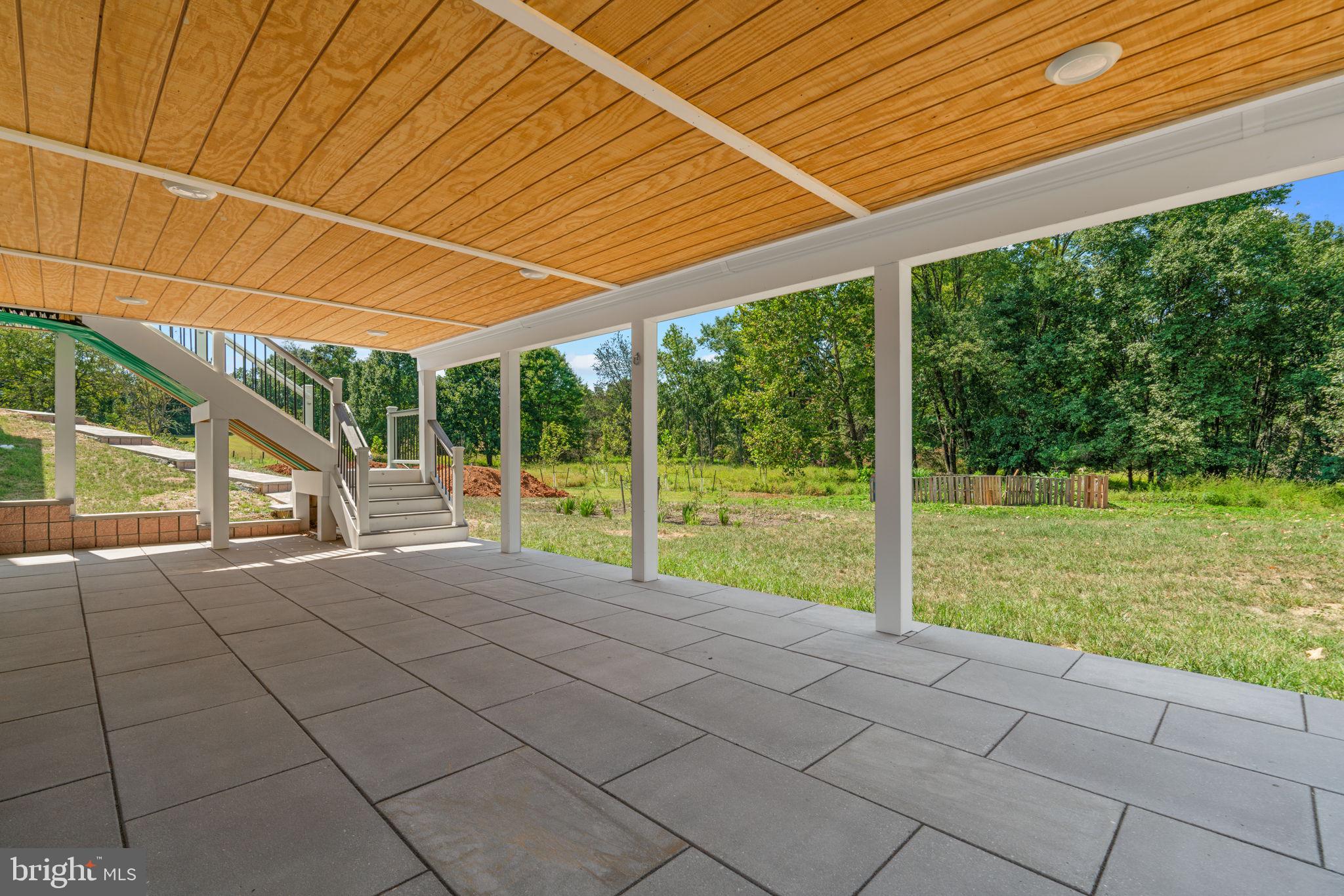 21708 Woodfield Road Gaithersburg, MD 20882 - Photo 61 of 76 a view of a house with backyard and a porch