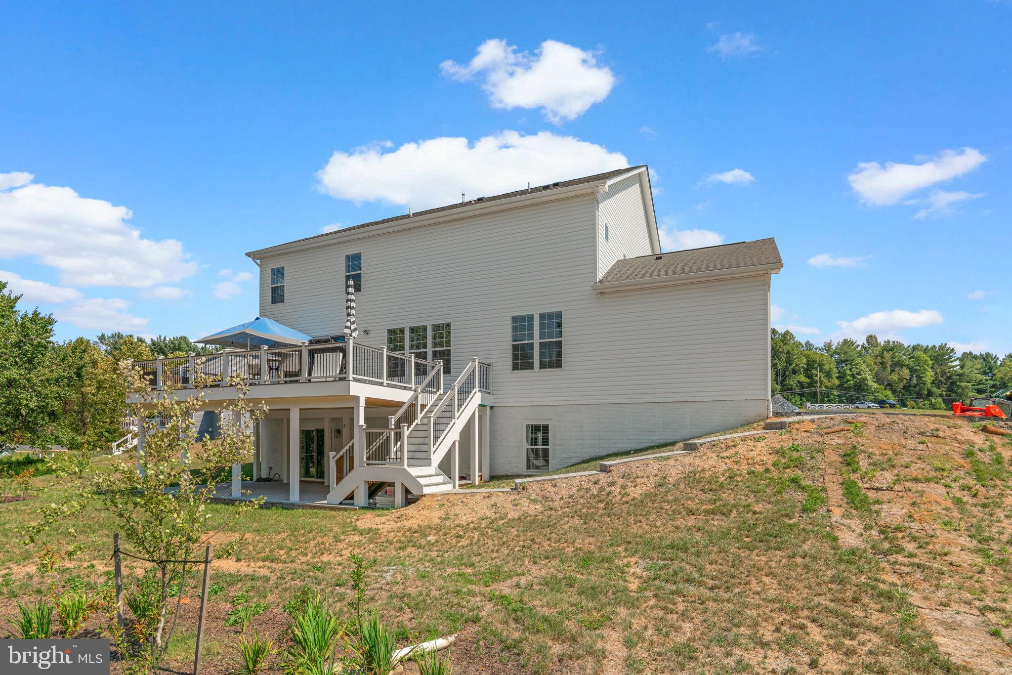 21708 Woodfield Road Gaithersburg, MD 20882 - Photo 65 of 76 a view of a house with a snow in the yard