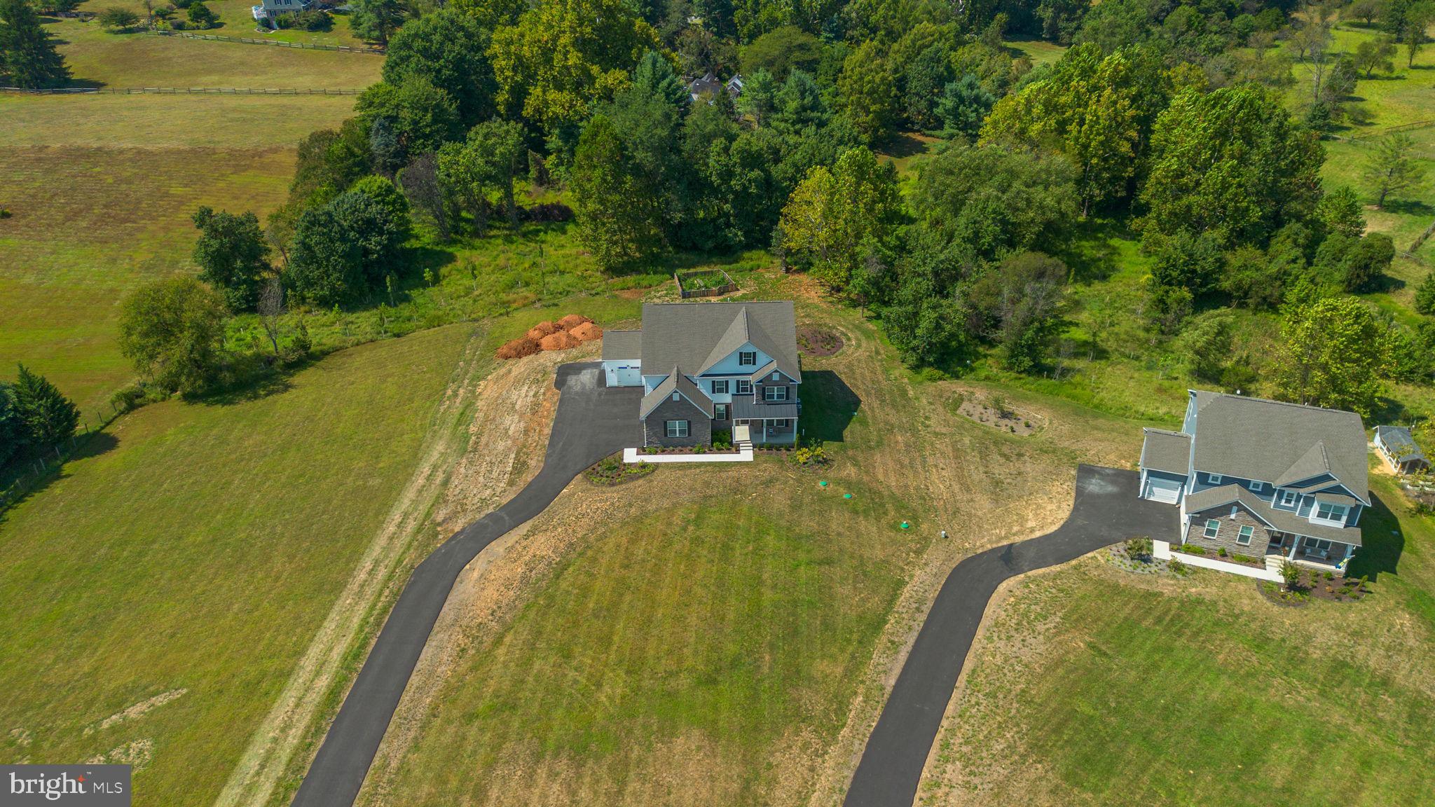 21708 Woodfield Road Gaithersburg, MD 20882 - Photo 68 of 76 a view of a swimming pool with a yard