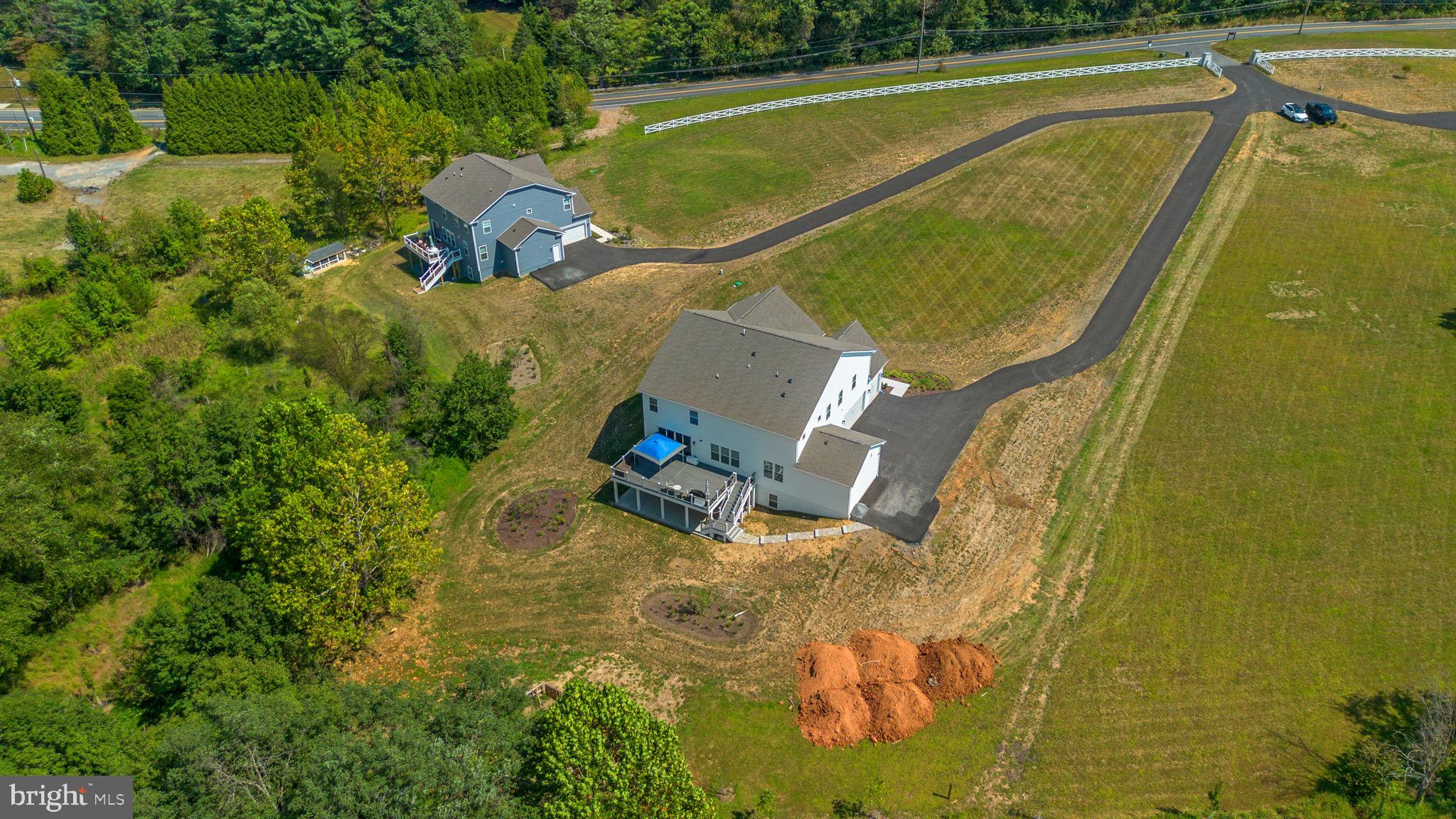 21708 Woodfield Road Gaithersburg, MD 20882 - Photo 70 of 76 an aerial view of a house with a swimming pool