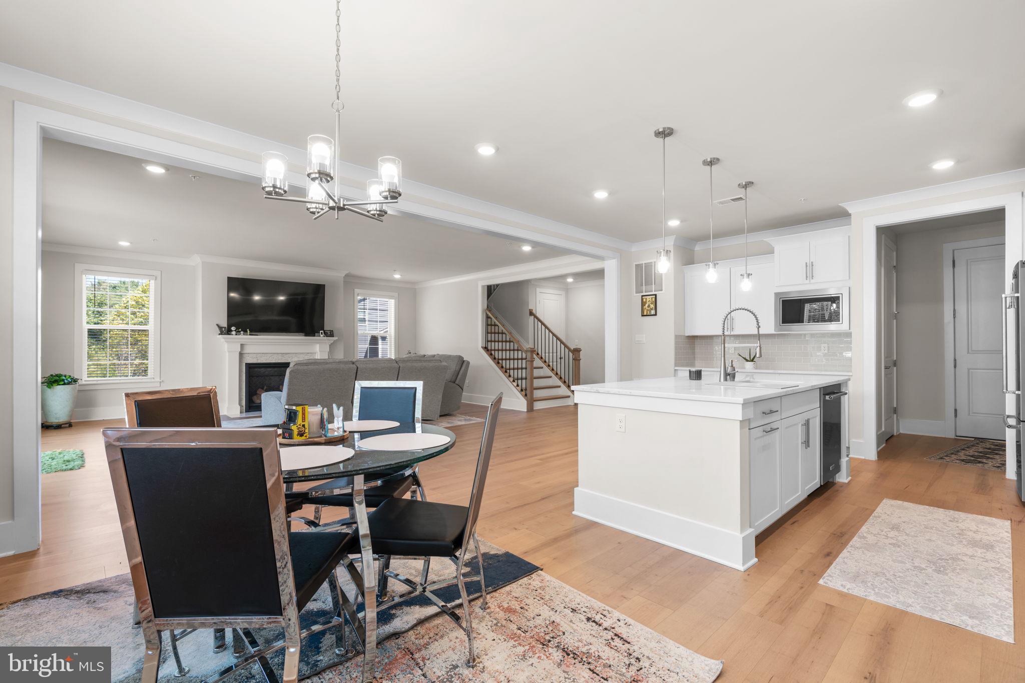 21708 Woodfield Road Gaithersburg, MD 20882 - Photo 7 of 76 a view of kitchen with cabinets table and chairs