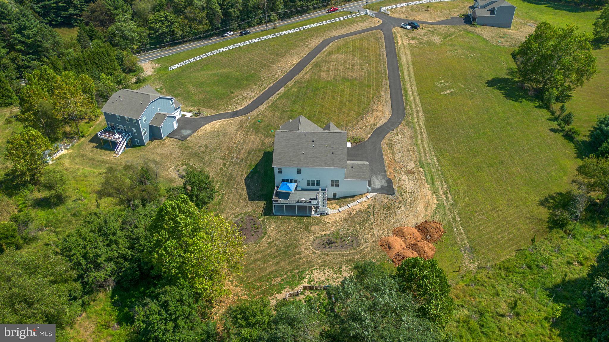 21708 Woodfield Road Gaithersburg, MD 20882 - Photo 71 of 76 an aerial view of residential house with outdoor space and swimming pool