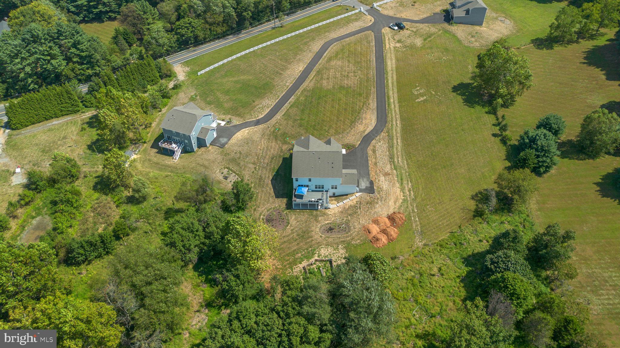 21708 Woodfield Road Gaithersburg, MD 20882 - Photo 73 of 76 an aerial view of residential house with outdoor space and lake view