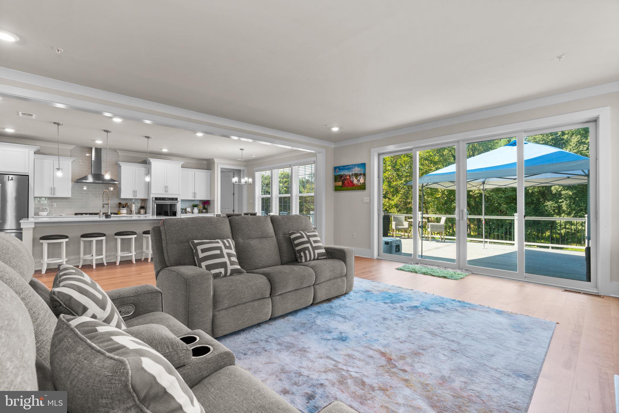 21708 Woodfield Road Gaithersburg, MD 20882 - Photo 10 of 76 a living room with furniture and a large window