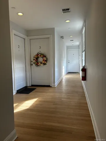 a view of entryway with wooden floor
