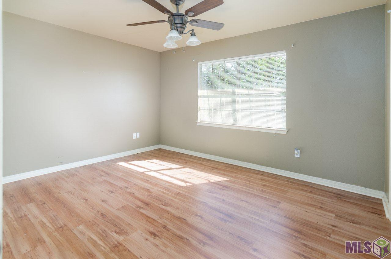 12416 South Harrells Ferry Road, Unit 4A Baton Rouge, LA 70816 - Photo 3 of 13 Bedroom 2 Suite