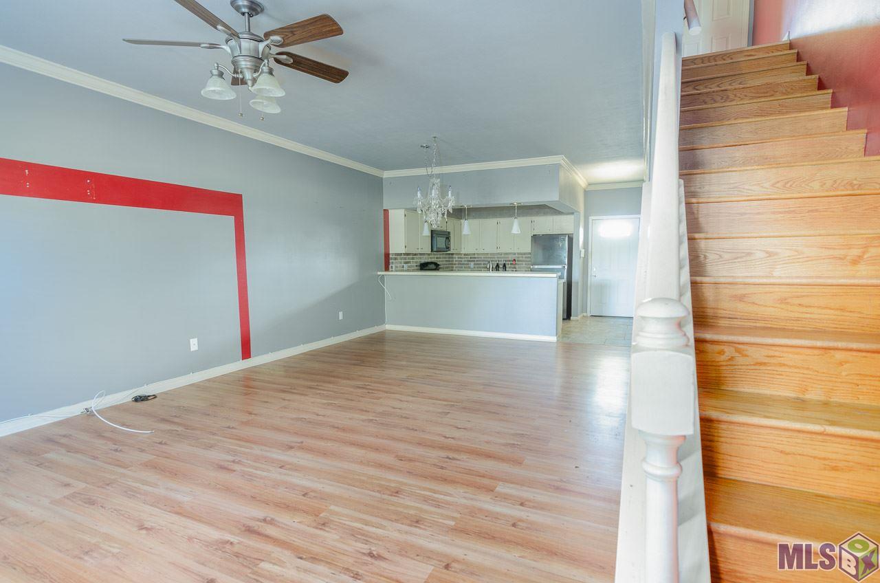 12416 South Harrells Ferry Road, Unit 4A Baton Rouge, LA 70816 - Photo 8 of 13 Living Room / Stairs