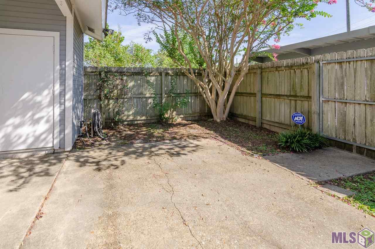 12416 South Harrells Ferry Road, Unit 4A Baton Rouge, LA 70816 - Photo 10 of 13 Fenced Back Patio