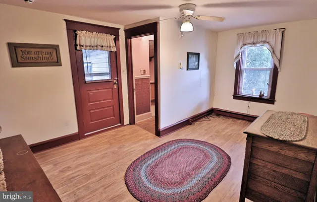 a living room with furniture and painting on the wall