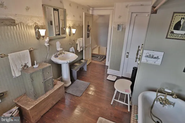 a kitchen with cabinets a sink and stainless steel appliances