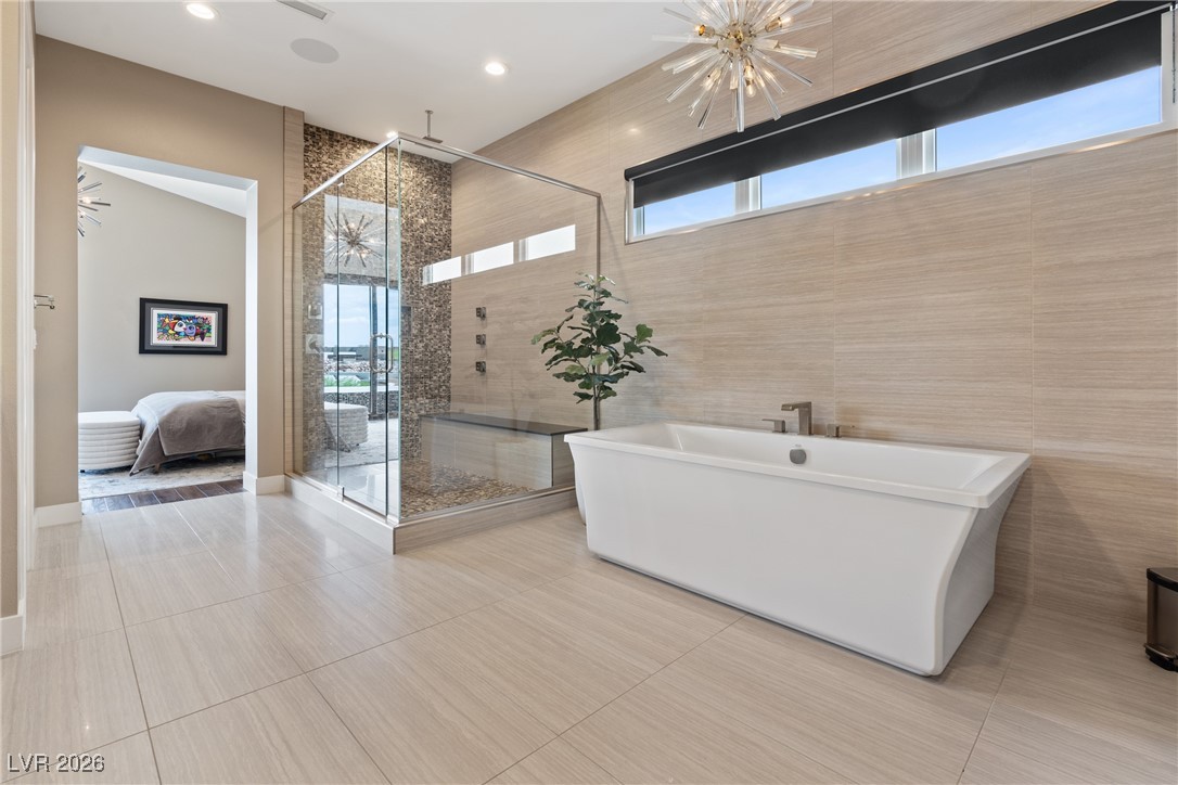 2224 Ledge Rock Lane Henderson, NV 89052 - Photo 29 of 66 Primary bathroom with standalone tub and shower, LED dual vanities, and wrap around finished closet