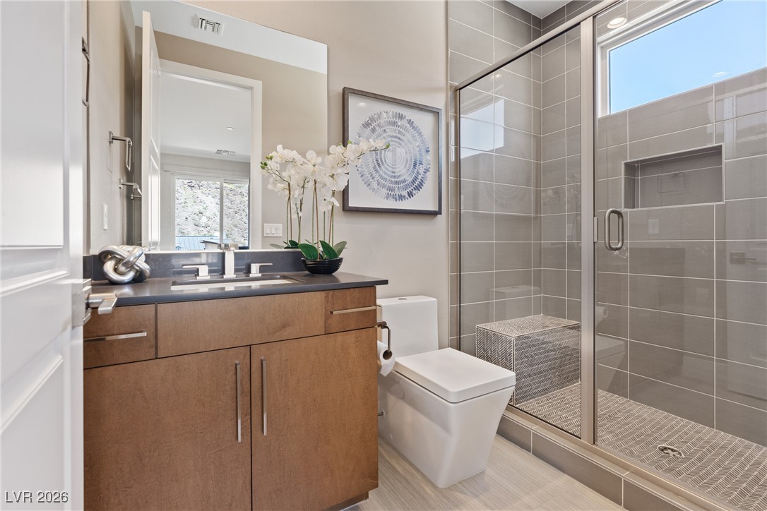 2224 Ledge Rock Lane Henderson, NV 89052 - Photo 39 of 66 Upstairs guest bedroom with ensuite bath, and balcony with mountain views