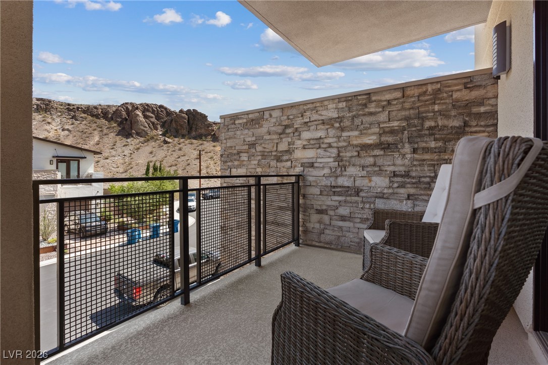 2224 Ledge Rock Lane Henderson, NV 89052 - Photo 41 of 66 Upstairs guest bedroom with ensuite bath, and balcony with mountain views