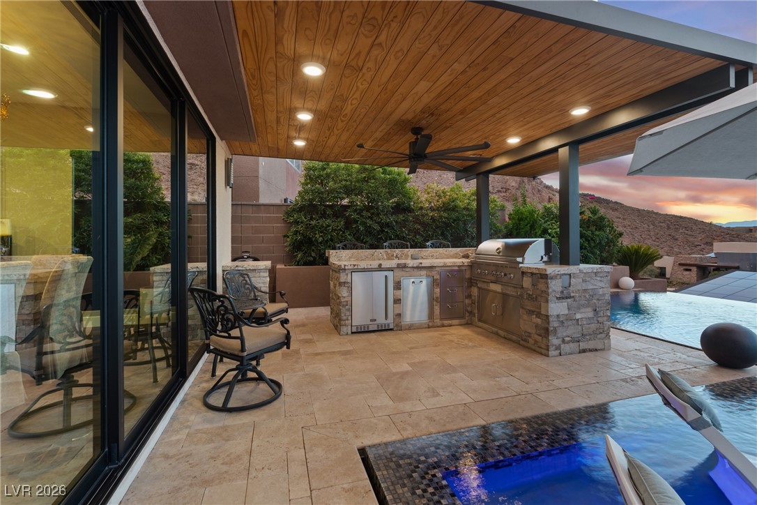 2224 Ledge Rock Lane Henderson, NV 89052 - Photo 46 of 66 Infinity edge pool and spa, and covered outdoor kitchen