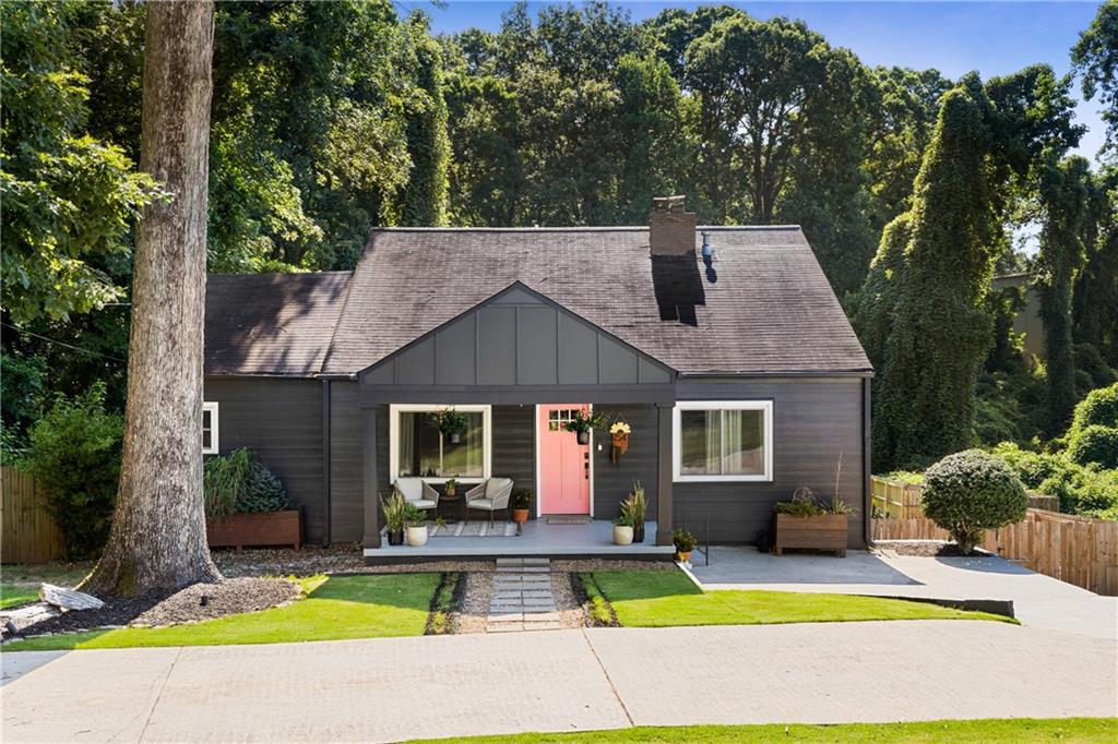 154 Candler Road Southeast Atlanta, GA 30317 - Photo 1 of 1 a view of house with swimming pool and outdoor seating