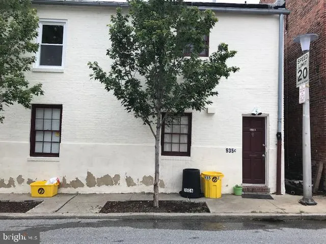 a house with trees in front of it
