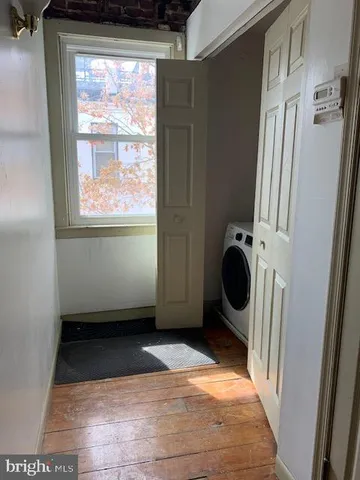 a view of a storage & utility room with a window