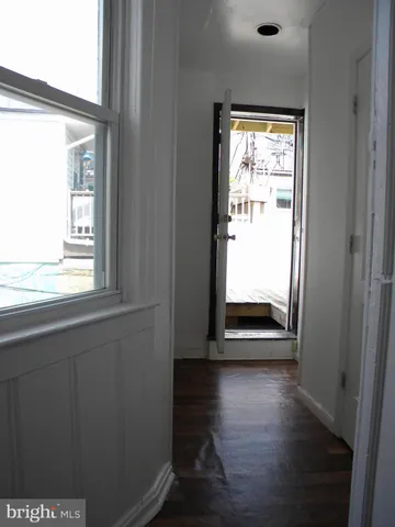 a view of balcony with wooden floor