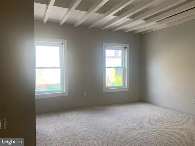 a bathroom with a bathtub and toilet