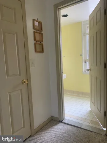 a bathroom with a white bathtub and a shower