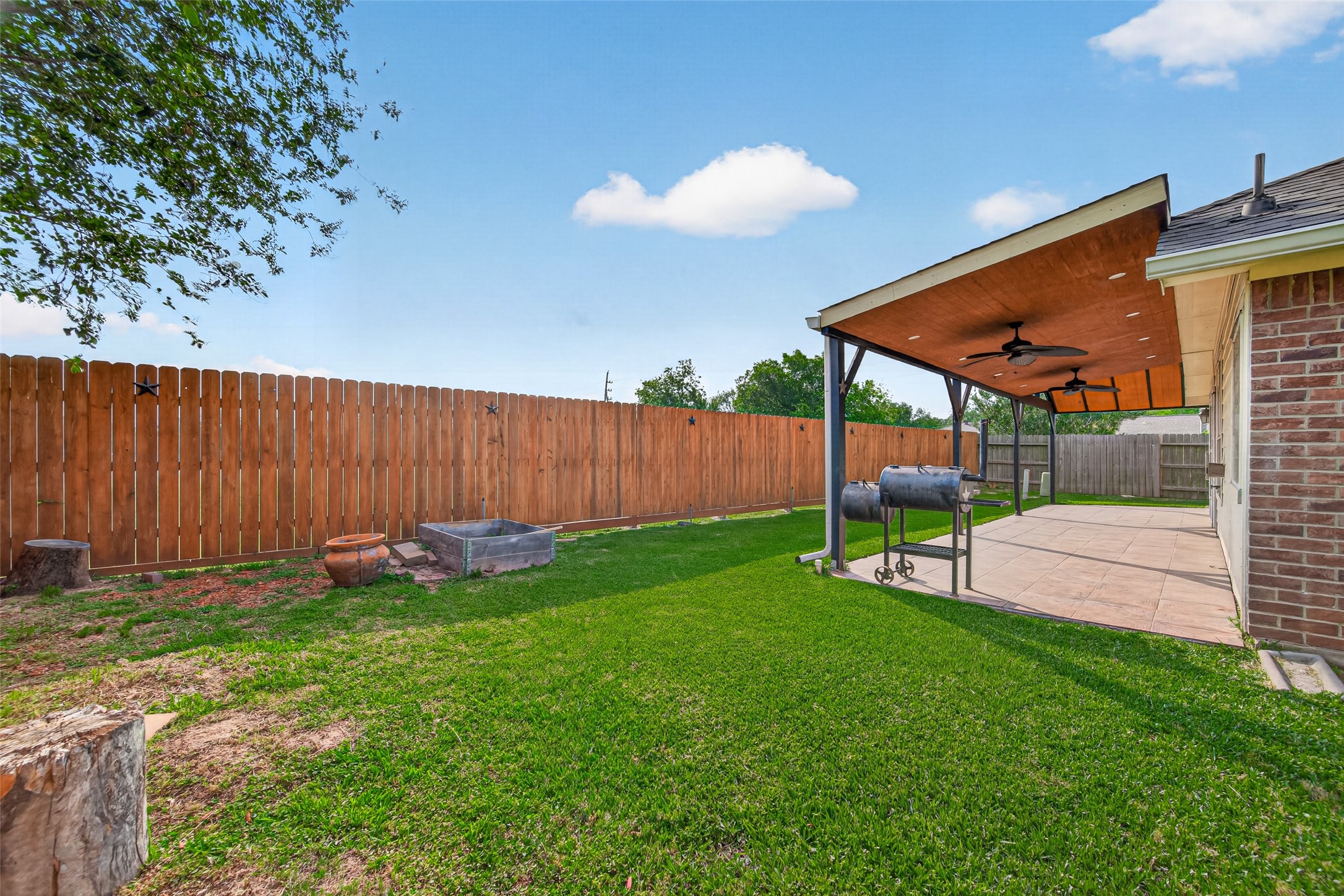 23914 Glengate Drive Spring, TX 77373 - Photo 46 of 49 a view of a backyard with a garden and seating space
