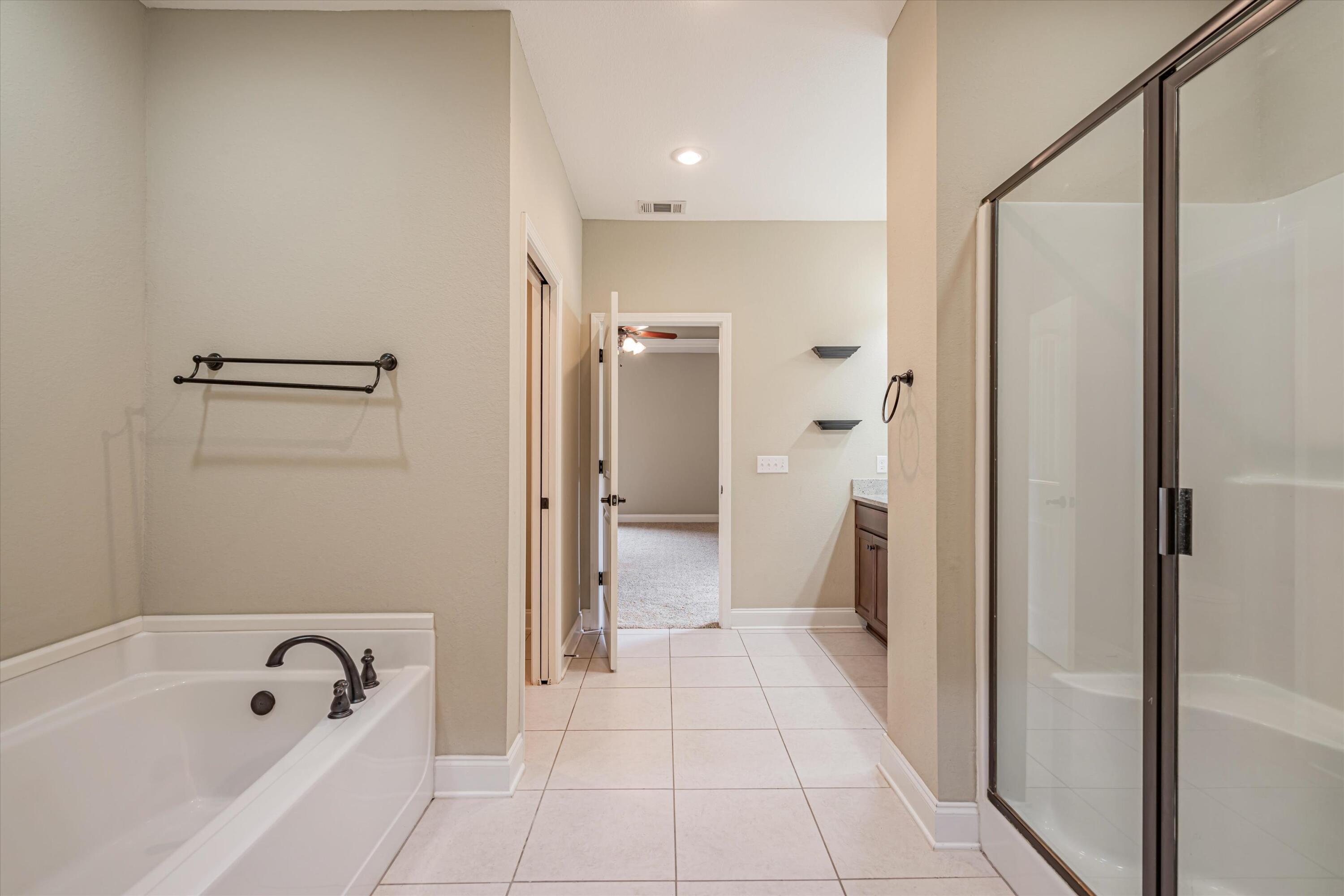 4529 Hermosa Road Crestview, FL 32539 - Photo 36 of 49 a bathroom with a bathtub and a shower