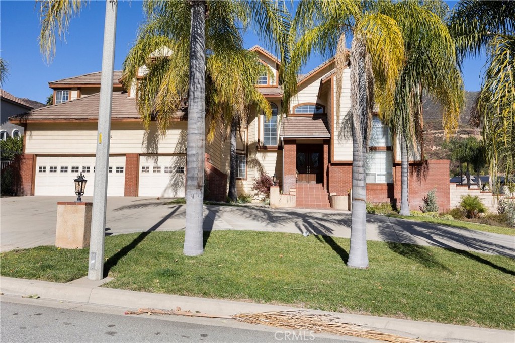 9170 Almond Street Rancho Cucamonga, CA 91737 - Photo 1 of 1 a view of a house with a yard and plants
