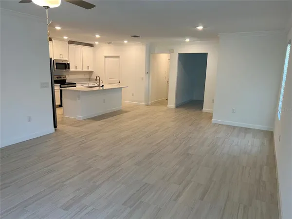 a view of kitchen with wooden floor