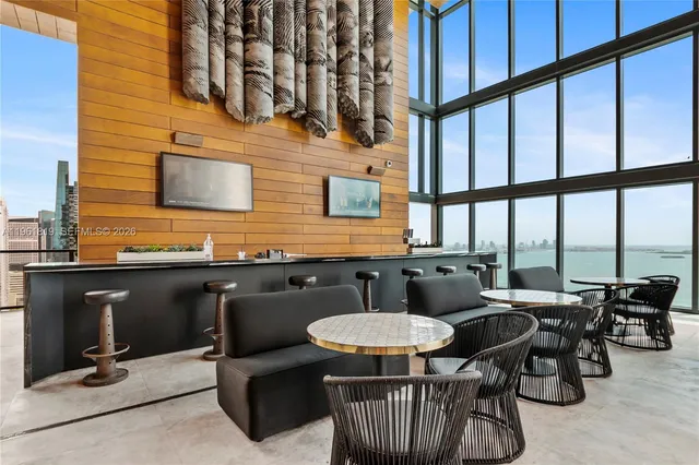 a outdoor dining space with furniture and outdoor view