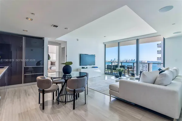 a living room with furniture and a large window