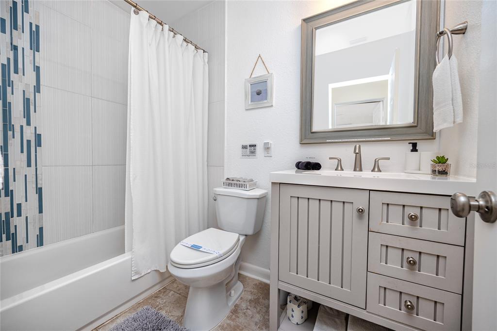 5596 100th Way North St. Petersburg, FL 33708 - Photo 46 of 67 a bathroom with a toilet a sink and a bathtub
