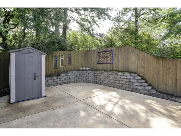 a view of a backyard of the house