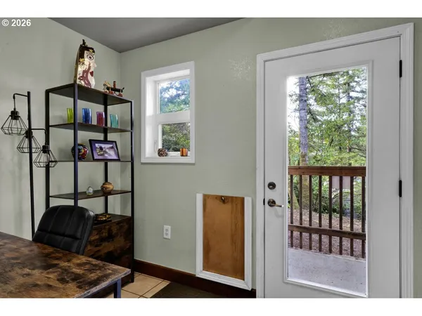 a view of a bedroom with furniture and windows
