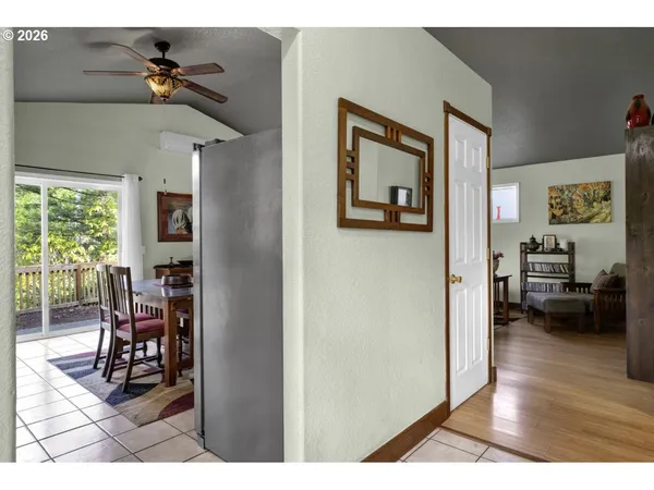 a view of a livingroom with furniture and a ceiling fan