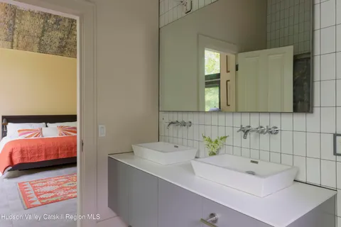 a en suite bathroom with a sink and a mirror