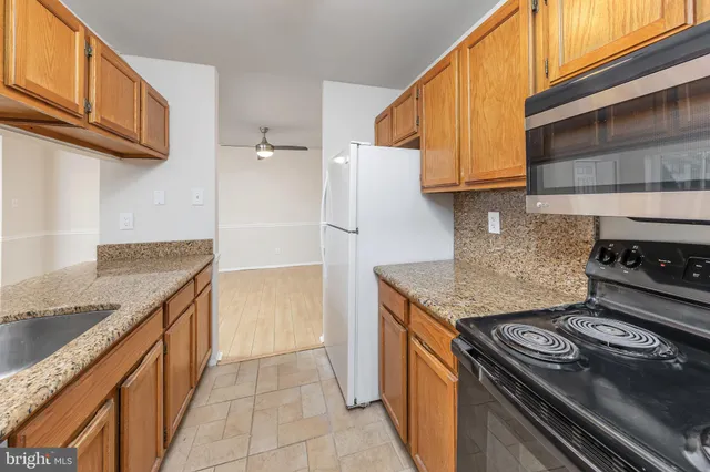 a kitchen with a stove and a kitchen