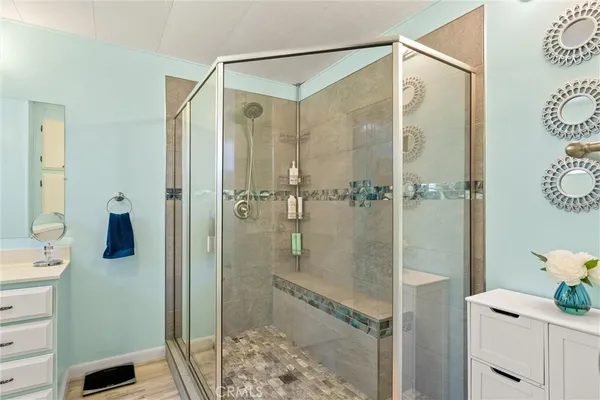 a bathroom with a shower and a sink