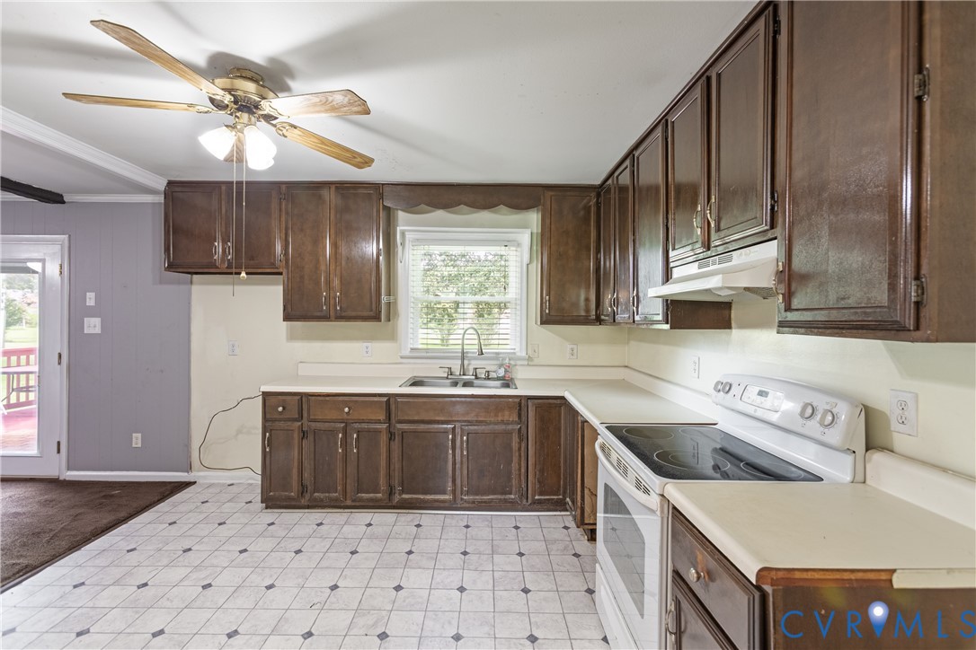2730 Kinvan Road Henrico, VA 23231 - Photo 21 of 37 Kitchen featuring dark wood-finish cabinetry, ligh